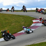 Steve Alexander (43) leads Ralph Staropoli (80), Noel Korowin (510), Bruce Testa (954), Paul Elledge (133), Adrian Jasso (12), Chloe Maddrill (456), Frank Schoenbeck (25) and the rest during an AHRMA race at PittRace. Photo by etechphoto.com, courtesy AHRMA.