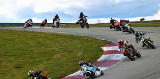 Steve Alexander (43) leads Ralph Staropoli (80), Noel Korowin (510), Bruce Testa (954), Paul Elledge (133), Adrian Jasso (12), Chloe Maddrill (456), Frank Schoenbeck (25) and the rest during an AHRMA race at PittRace. Photo by etechphoto.com, courtesy AHRMA.