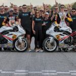 Michelle A. Lindsay (center) with husband Myles Wilson (to Lindsay's immediate right), riders Danny Eslick (left) and Brandon Paasch (right), and the rest of the TOBC Racing team ahead of the 2022 Daytona 200. Photo courtesy Triumph.