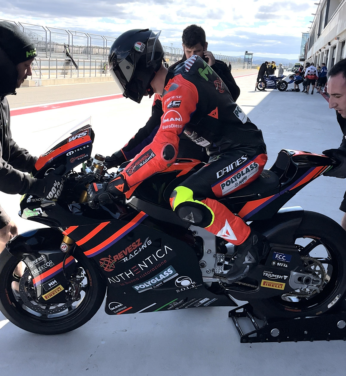 American Rossi Moor's second test day was cut short by blustery winds. Here, his bundled-up crew starts his Moto2 racebike. MMR Racing Photo.