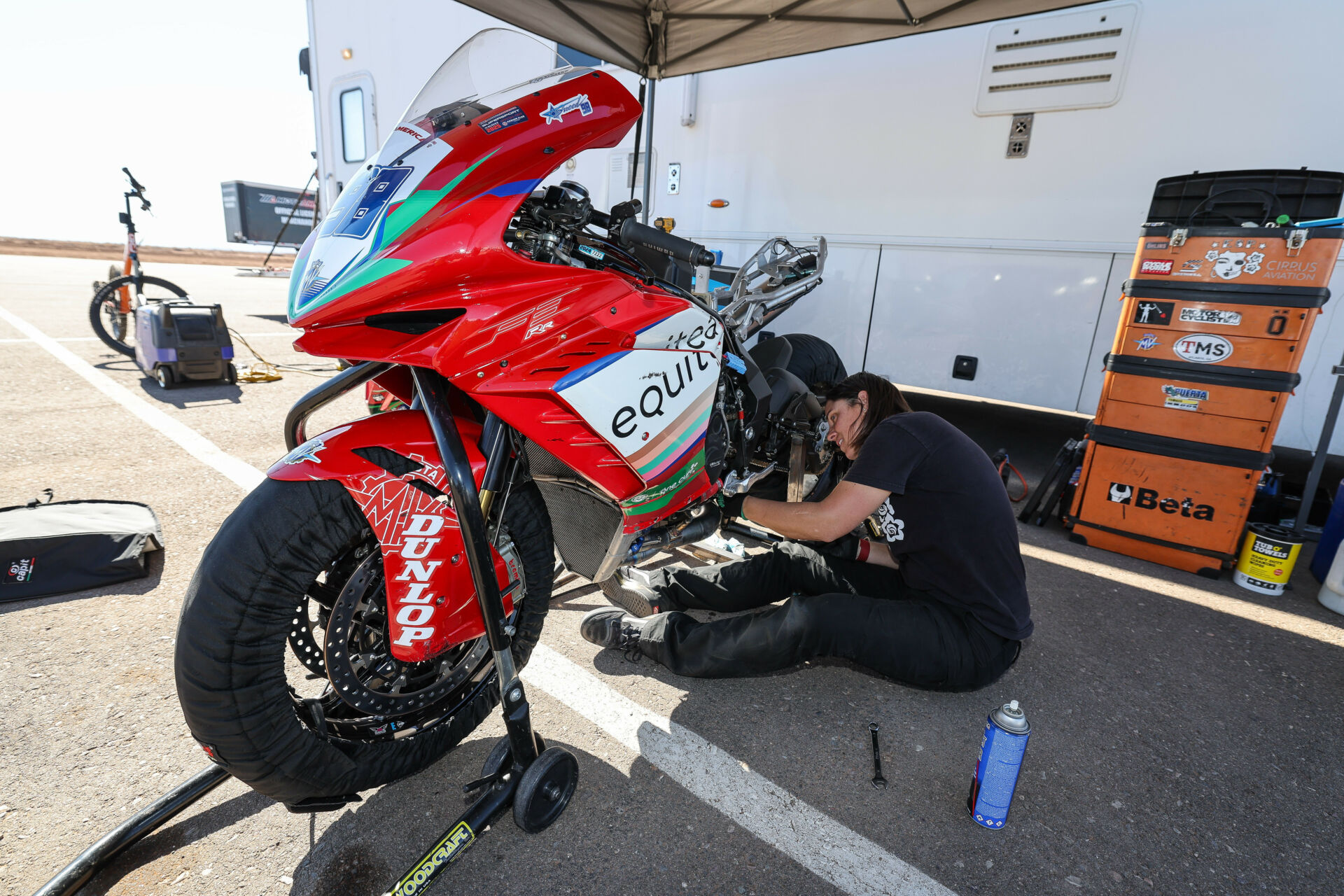 Melissa Paris working on an MV Agusta F3-800